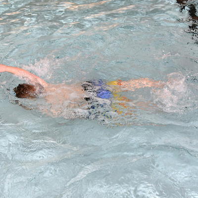 Child swimming in pool